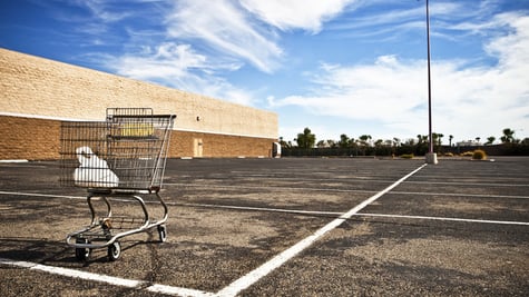 Abandoned shopping cart, empty parking lot